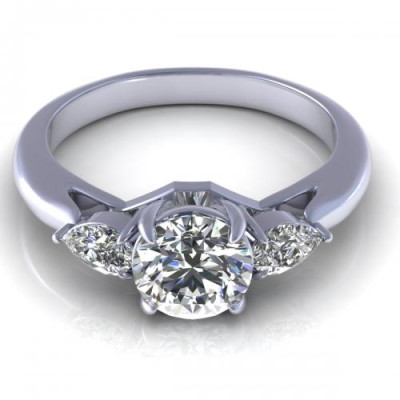0.65CT round and pear cut diamonds three stone ring