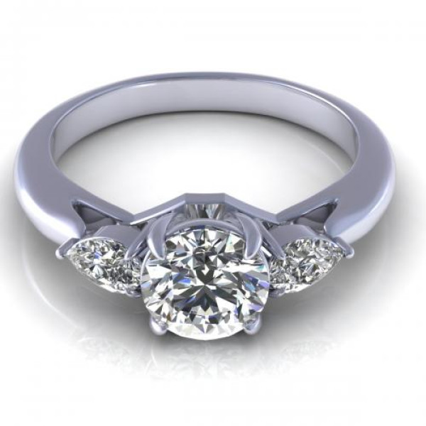 0.65CT round and pear cut diamonds three stone ring